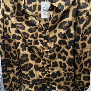 Animal print button down blouse. Tag attached . Never worn